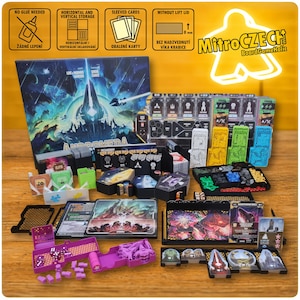 May include: A board game set with various components, including cards, dice, and game pieces. The box art features a futuristic landscape with the word "ANDROMEDA." The game pieces are in various colors, including purple, green, and yellow. The set includes a variety of game accessories.