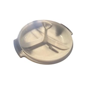 May include: A white plastic kitchen gadget with a handle and three sections. The gadget is round and has a handle in the center. The sections are divided by three curved blades. The item is designed for food preparation.