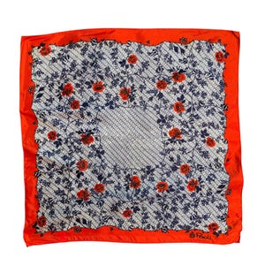 May include: Square silk scarf with a white and gray lattice pattern, adorned with red roses and dark blue vines. The scarf has a bright orange border. The lower right corner has the text "Paoli".