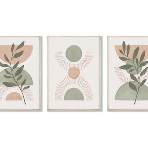 May include: Set of three framed prints with abstract geometric shapes in shades of green and pink, with a stylized leaf branch in each print.