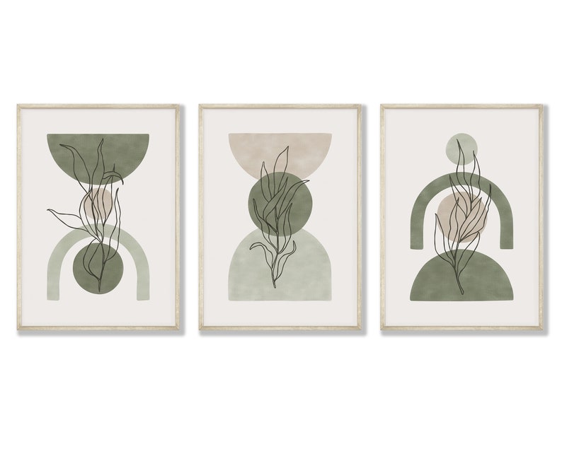 May include: Set of three framed prints with abstract geometric shapes in shades of green and beige, featuring a line drawing of a leafy branch in each print.