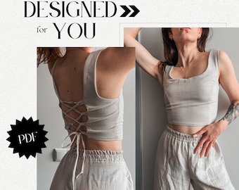 May include: A PDF sewing pattern for a beige linen top with a lace-up back. The top is cropped and has a square neckline. The model is wearing the top with matching beige linen pants.