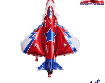 May include: Red, white, and blue foil balloon in the shape of a fighter jet. The balloon features a large blue star and white lightning bolt designs. Measures 42 x 37 inches.