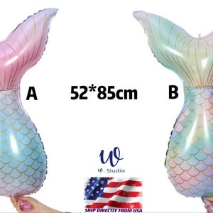 May include: Two mermaid tail shaped foil balloons, one pink and blue, the other blue and green, with gold glitter scales.  The balloons are 52 inches by 85 centimeters.