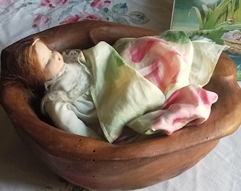 Thumbelina asleep in her nutshell