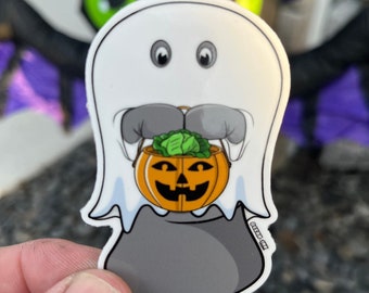 Cukierek albo psikus, słodka 3-calowa naklejka na Halloween z manatem.