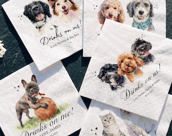 May include: A collection of white square paper napkins featuring watercolor illustrations of various dogs and a cat. Each napkin includes printed text such as Drinks on us, Drinks on me, or Cheers to forever, along with names and dates.