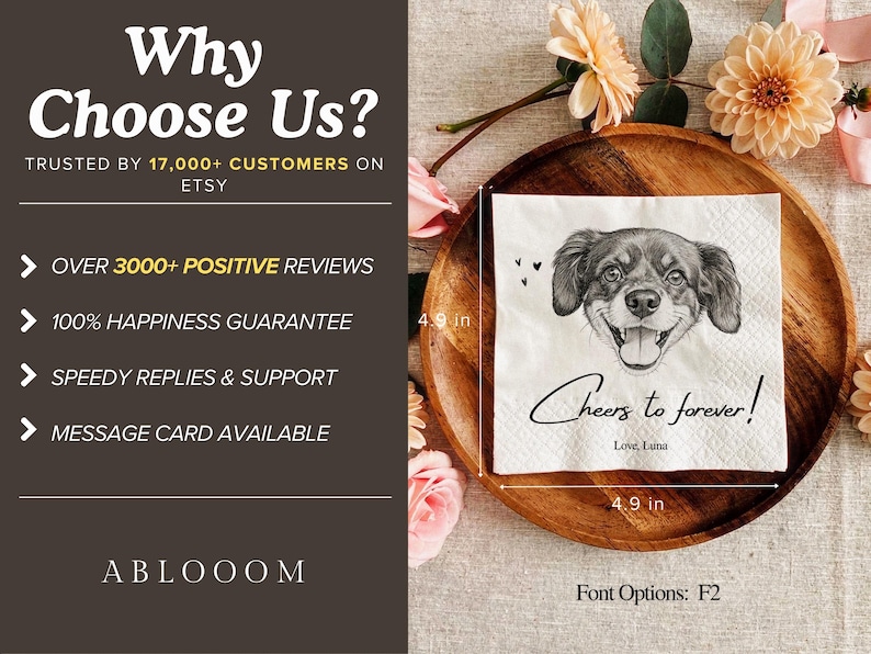 May include: A square white paper napkin featuring a black and white sketch of a dog's face, the text "Cheers to forever!" and "Love, Luna". A measuring tape indicates the napkin is 4.9 inches by 4.9 inches. The napkin rests on a round wooden tray.