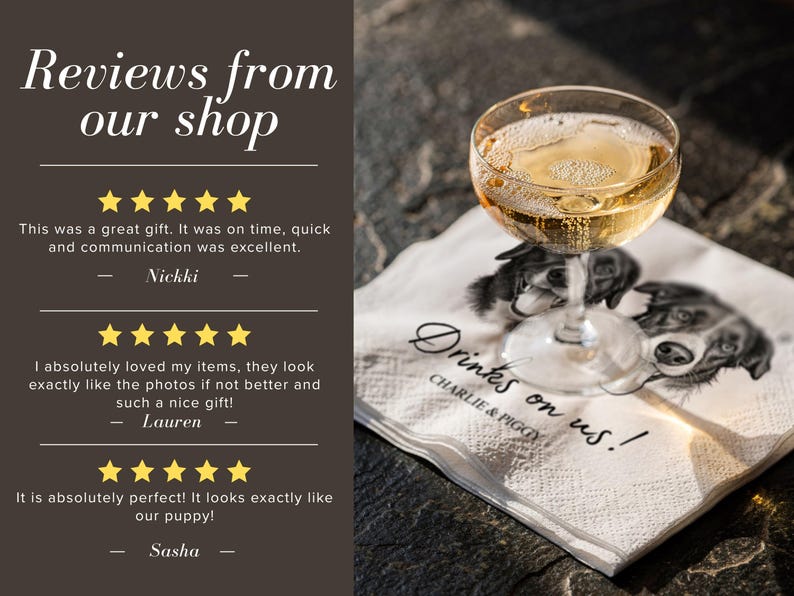 May include: A white paper napkin featuring a black and white illustration of two dogs, with the text "Drinks on us!" and "CHARLIE & PIGGY" printed in black. A clear glass filled with a golden liquid sits on top of the napkin.