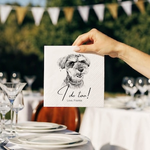 May include: A square white paper napkin featuring a black and white sketch of a Schnauzer dog. Below the dog illustration, the text reads "I do too!" in a cursive script, followed by the printed text "Love, Frankie" in a simple font.