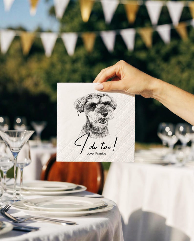 May include: A square white paper napkin featuring a black and white sketch of a Schnauzer dog. Below the dog illustration, the text reads "I do too!" in a cursive script, followed by the printed text "Love, Frankie" in a simple font.