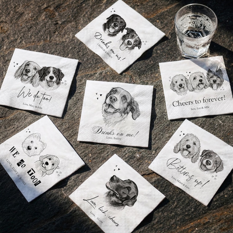 May include: Six square white paper napkins featuring black and white pencil-style illustrations of dogs. Each napkin displays unique text such as Drinks on me!, We do too!, and Cheers to forever!, along with personalized names and small heart icons.