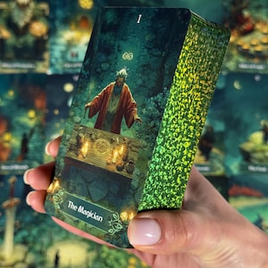 May include: A deck of tarot cards held in a hand, featuring a card with the text "The Magician." The card depicts an illustration of a bearded figure in a red robe standing behind a table with candles and objects. The deck's edges have a green, textured design.
