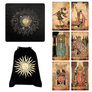 May include: Black velvet tarot card bag with a gold sun design. Includes a black velvet square with a gold sun and moon design, and six tarot cards with vintage illustrations and titles like "The Fool" and "The Magician."