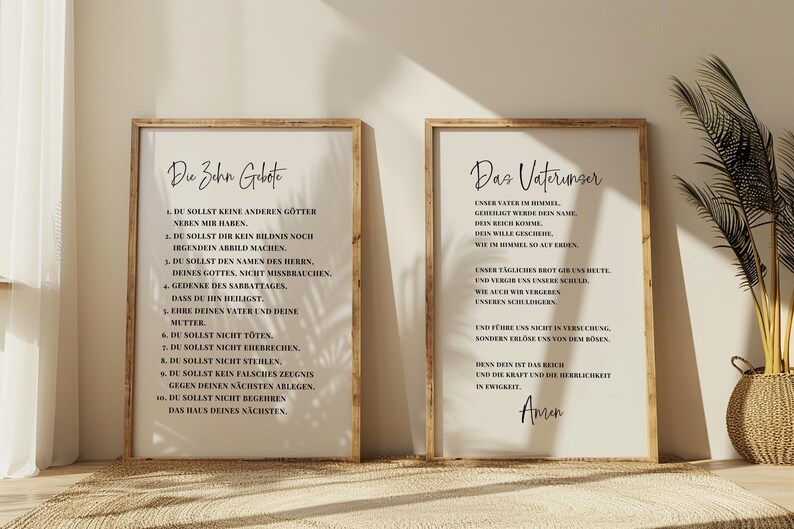 May include: Two framed prints with text in German. The left print says "The Ten Commandments" and the right print says "The Lord's Prayer". Both prints have a light background and a wooden frame. The text is in black.