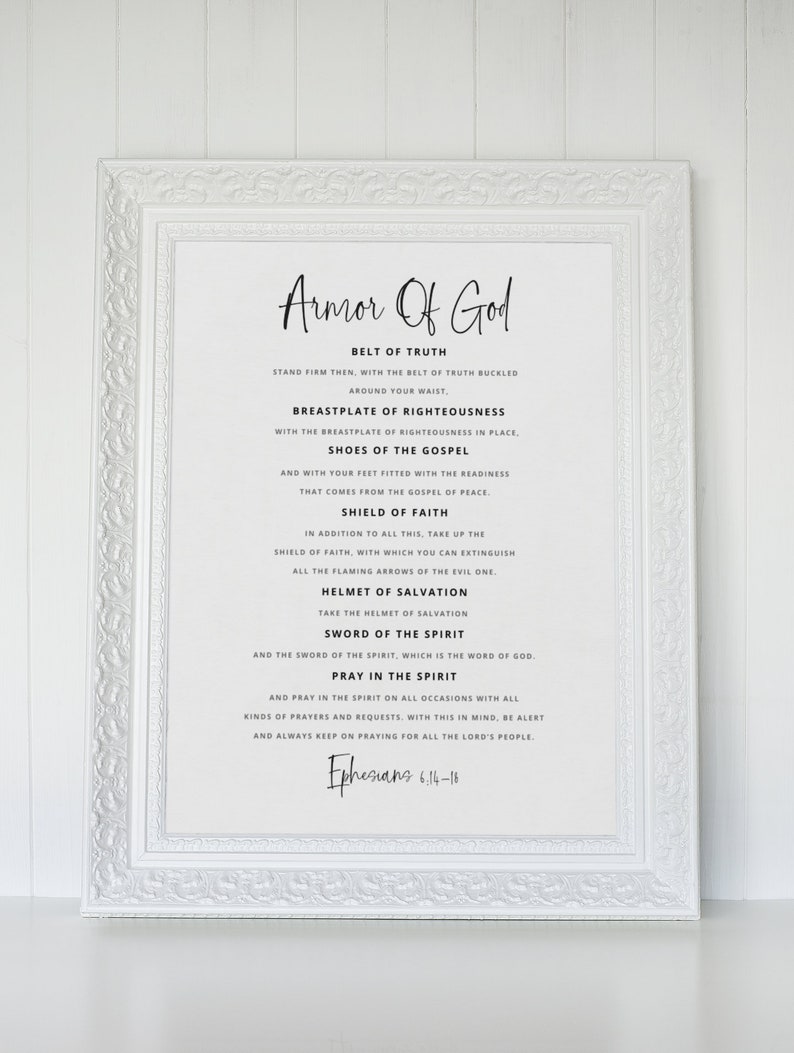 May include: A white framed print with black text outlining the Armour of God, a Christian concept. The text includes the Bible verse Ephesians 6:14-18.