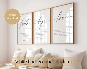 May include: Three white framed prints with black text on a white background. The prints feature the words "faith", "hope", and "love" with bible verses about each word.