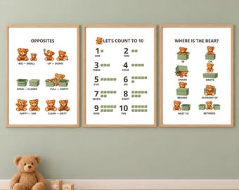 May include: Three framed educational posters featuring brown teddy bears. The first poster shows opposites, the second counts from one to ten, and the third illustrates spatial prepositions. Each poster has a white background and light wood frames.