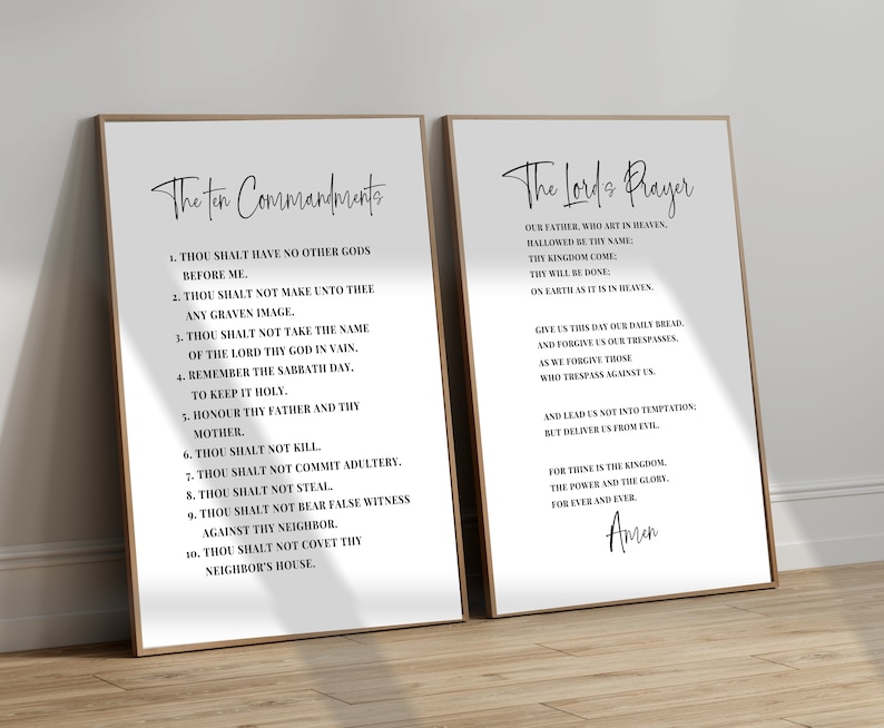 May include: Two framed prints with black text on a white background. The left print displays "The Ten Commandments" and the right print displays "The Lord's Prayer". Both prints have a simple, elegant design with a wooden frame.