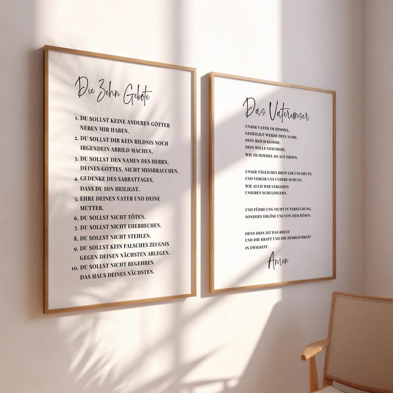 May include: Two framed art prints with black text on a white background. The left print displays "Die Zehn Gebote" (The Ten Commandments), and the right print shows "Das Vaterunser" (The Lord's Prayer). Both are in German.