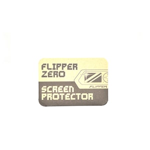 May include: A brown and yellow rectangular sticker with the text "FLIPPER ZERO SCREEN PROTECTOR" and a small image of a device with a screen.