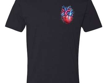 May include: A black short-sleeve t-shirt featuring a small, detailed graphic of an anatomical human heart on the upper left chest. The heart illustration displays vibrant red muscle tissue contrasted with deep blue veins and arteries.