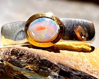 Australian precious opal, orange-green metallic, in silver with gold-plated setting. Craftsman's price.