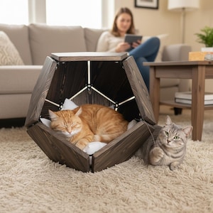 May include: A set of three ceramic mugs with a speckled, matte finish. The mugs are in shades of cream, light gray, and dark gray. Each mug has a simple, minimalist design, perfect for coffee or tea.