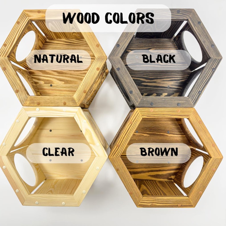 May include: Four hexagonal wooden cat beds in different wood finishes: natural, black, clear, and brown. The beds have a round opening on each side. The text "WOOD COLORS" is at the top of the image.