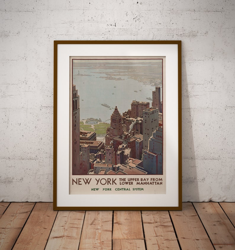 May include: Vintage travel poster advertising the New York Central System with a view of the Upper Bay from Lower Manhattan. The poster features a colorful illustration of the city skyline with the text "New York, The Upper Bay from Lower Manhattan, New York Central System."