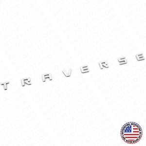 May include: Silver metal letters spelling out the word "TRAVERSE".