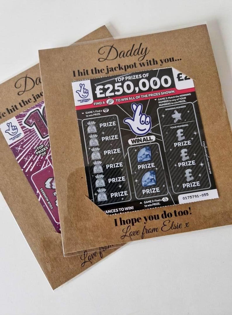 May include: Two brown paper cards with lottery tickets. One ticket shows a top prize of &pound;250,000. Text on the cards reads "Daddy, I hit the jackpot with you..." and "I hope you do too! Love from Elsie x."