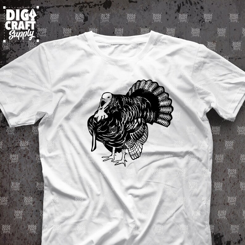May include: A white t-shirt with a black silhouette of a turkey on the front. The turkey is facing to the left and has its wings spread out.