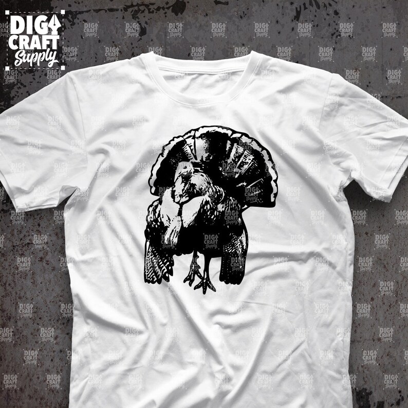 May include: A white t-shirt with a black silhouette of a turkey with its head tucked under its wing.