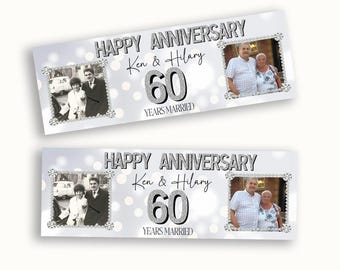 May include: A rectangular banner featuring the text HAPPY ANNIVERSARY, Ken & Hilary, 60 YEARS MARRIED, and two framed photos. One photo shows a couple in black and white, the other a couple in color, all set against a silver bokeh background.