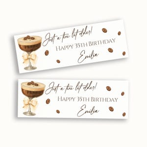 May include: Two rectangular white labels featuring a watercolor illustration of a martini glass filled with dark coffee, topped with three coffee beans and a cream-colored bow. Text reads: Just a tini bit older! HAPPY 35TH BIRTHDAY Emilia.