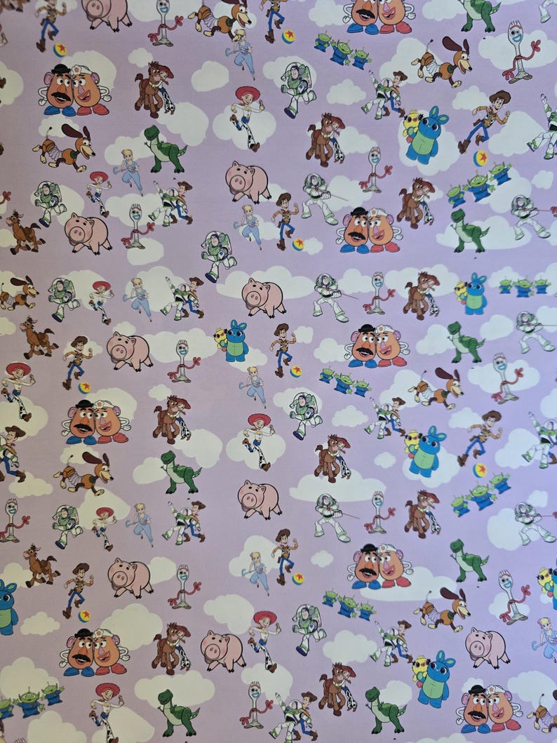 May include: A light purple background with a repeating pattern of characters from the animated film Toy Story. The pattern includes characters such as Woody, Buzz Lightyear, Mr. Potato Head, and others, along with white cloud shapes.