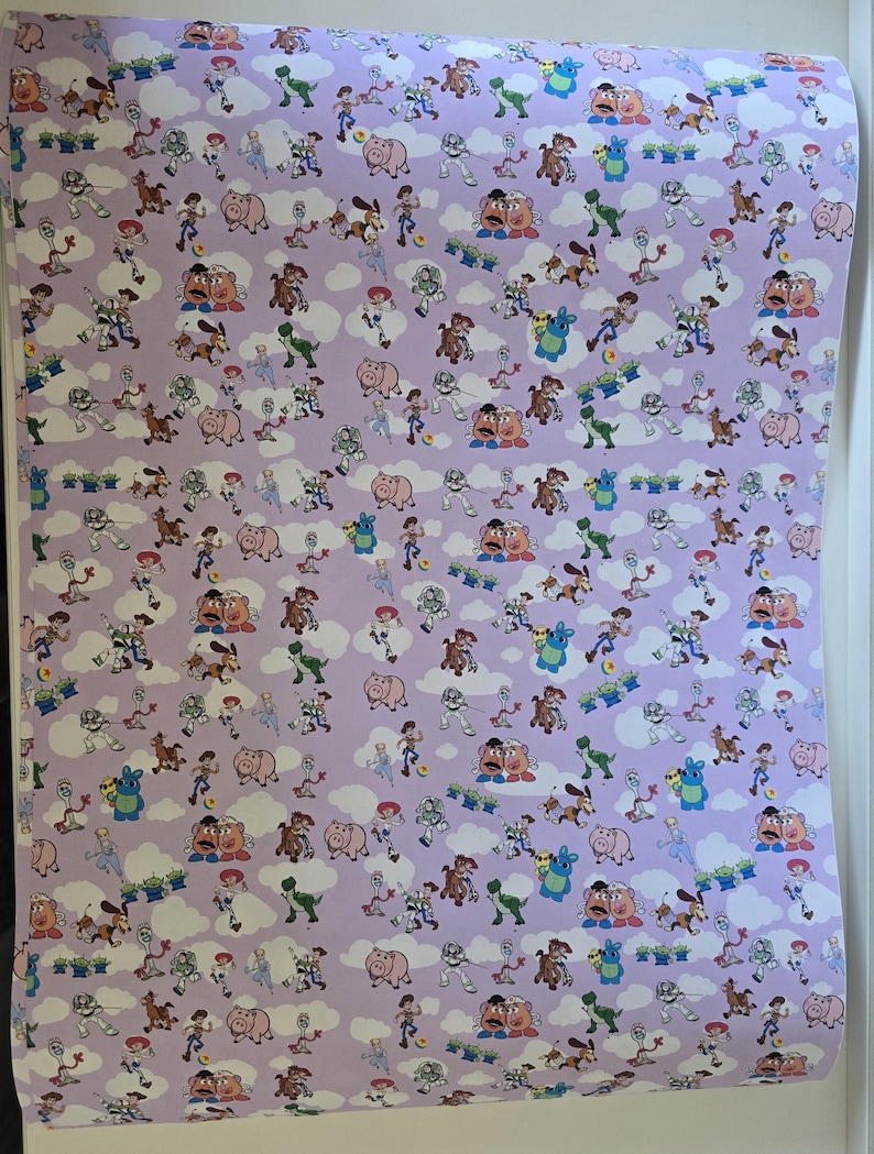 May include: Wallpaper featuring a repeating pattern of characters from the animated film Toy Story. The design includes Woody, Buzz Lightyear, Rex, Hamm, Mr. Potato Head, and other characters, set against a light purple background with white cloud accents.