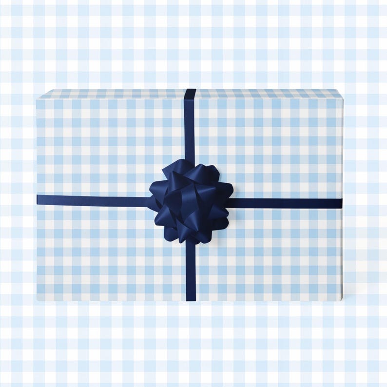 May include: A rectangular gift box wrapped in light blue and white checkered paper. A dark blue ribbon crosses the top and is tied with a large bow. The background is a light blue and white checkered pattern.