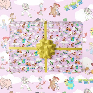 May include: A wrapped present with a light purple background featuring cartoon characters. The gift is wrapped in paper with a repeating pattern of characters and clouds. A yellow ribbon and bow adorn the gift.