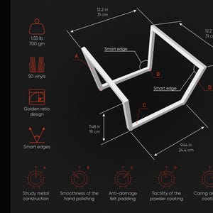 May include: A white metal object with a geometric design, featuring smart edges. The object is 12.2 inches (31 cm) wide and 7.48 inches (19 cm) tall. It weighs 1.55 pounds (700 gm) and is designed with a golden ratio. The image also highlights features like anti-damage felt padding.