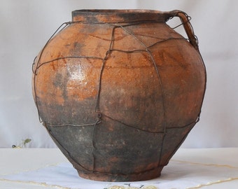 old clay pot. Wabi sabi brown black pottery. Farm house Rustic Decor