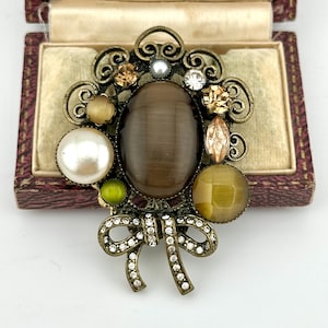 Vintage 1960s Victorian Brooch, Baroque Revival Assemblage Cat’s Eye Glass, Faux Pearls & Rhinestones Bow Pin, Collectable Statement Jewelry