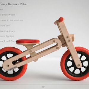 May include: A wooden balance bike with a red seat and tires. The bike is made of natural birch wood and is designed for children aged 2-5 years old. The bike has a 32-inch length and is 19 inches high. The text "Cranberry Balance Bike" is at the top.
