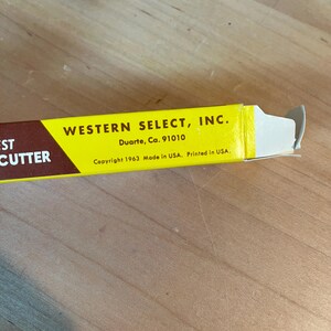 May include: A yellow and brown box for a cutter, with the text "WESTERN SELECT, INC." and "Duarte, Ca. 91010". The box also includes the text "Copyright 1963 Made in USA. Printed in USA."