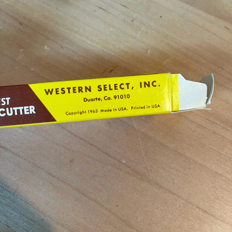 May include: A yellow and brown box for a cutter, with the text "WESTERN SELECT, INC." and "Duarte, Ca. 91010". The box also includes the text "Copyright 1963 Made in USA. Printed in USA."