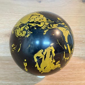 May include: A rustic wooden sign with the text "Welcome to our home" in white lettering. The sign features a distressed finish and a simple, inviting design, perfect for a front porch or entryway.