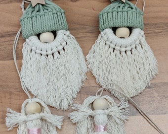 May include: Four handmade macrame ornaments. Two are gnomes with green hats and wooden star accents, and two are angels with pink ribbon accents. All have wooden bead faces and are made of off-white yarn.
