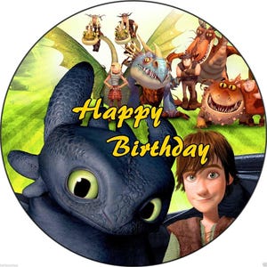 May include: A circular image featuring characters from the "How to Train Your Dragon" franchise. The image includes a black dragon, a young man, and the text "Happy Birthday" in yellow. Other dragons and characters are also present.