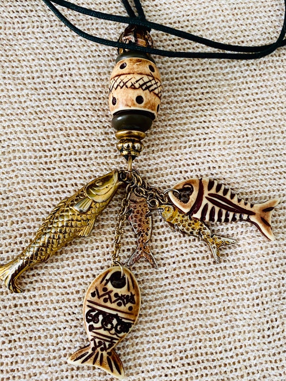Corded fish charmed necklace